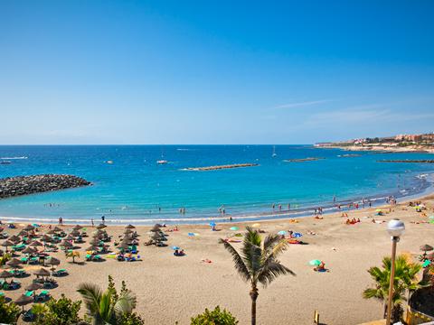 Panoramic view of Tenerife with coastal cliffs and the Teide volcano